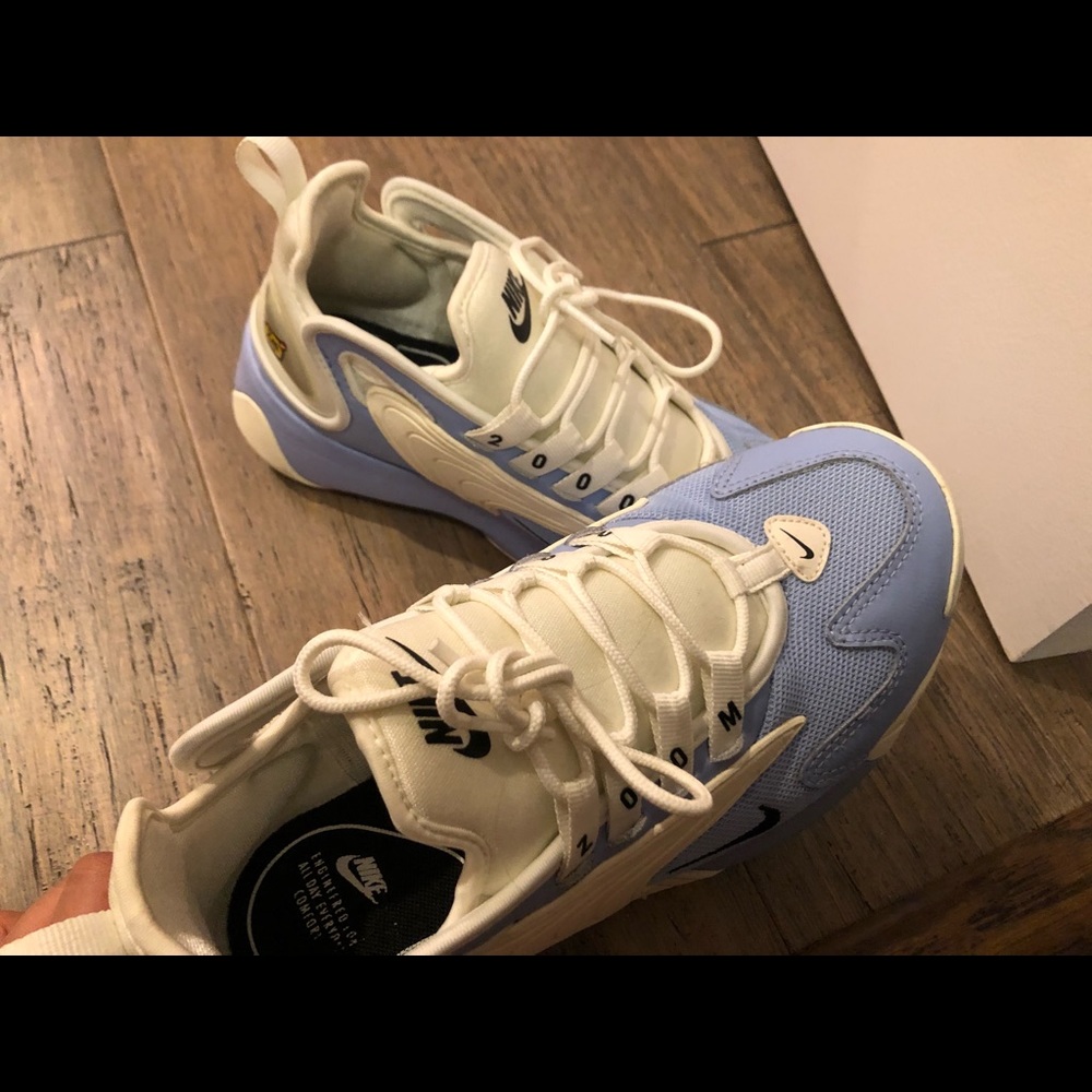 Blue and white Nike zoom 2k